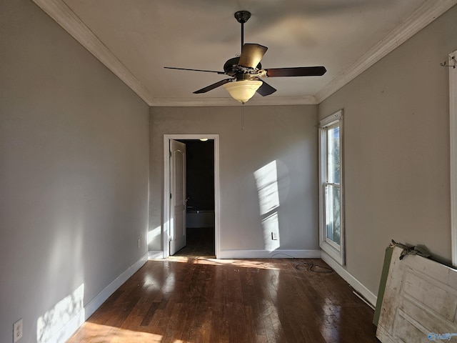 empty room with ceiling fan, dark hardwood / wood-style floors, and ornamental molding