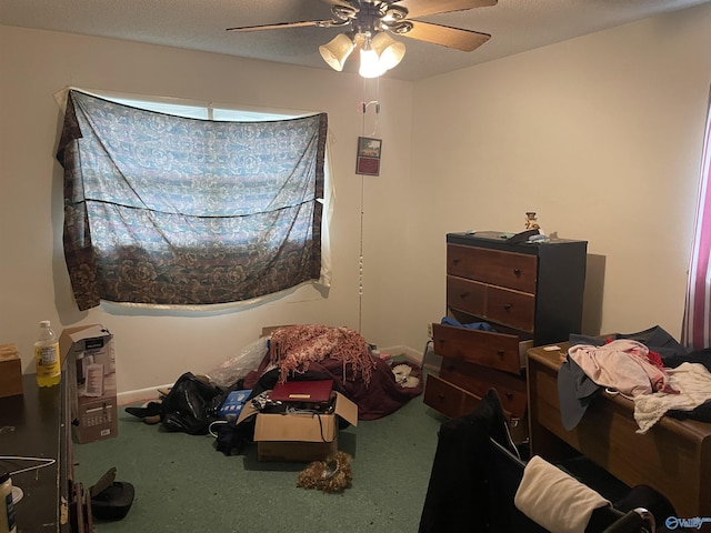 carpeted bedroom with ceiling fan and a textured ceiling