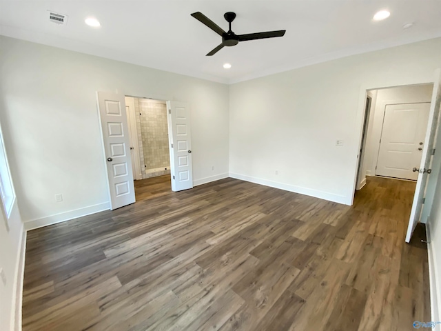 unfurnished bedroom featuring ceiling fan and dark hardwood / wood-style floors