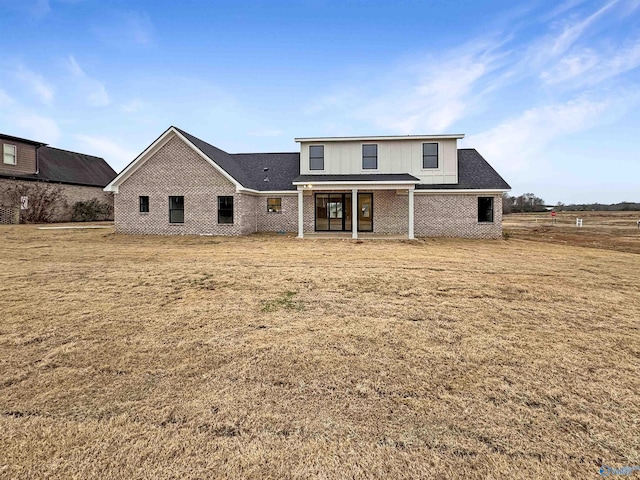 view of front of home with brick siding