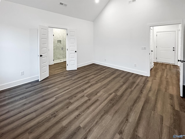 unfurnished bedroom with dark wood-style flooring and baseboards