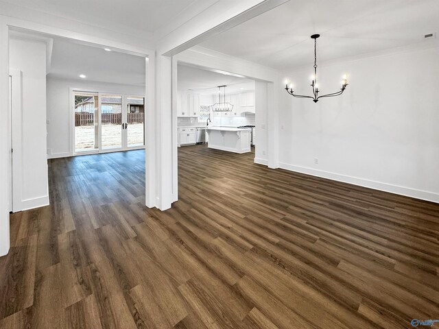 unfurnished living room featuring hardwood / wood-style flooring