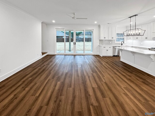 kitchen featuring a center island, hanging light fixtures, dark hardwood / wood-style floors, stainless steel refrigerator with ice dispenser, and white cabinets