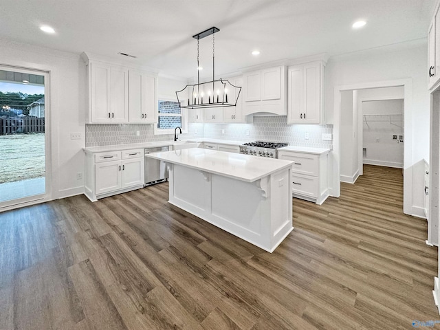 kitchen with a sink, white cabinets, and stainless steel dishwasher