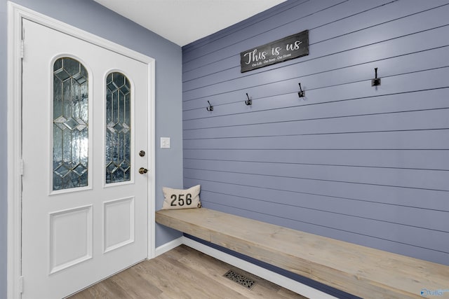 mudroom with light hardwood / wood-style flooring