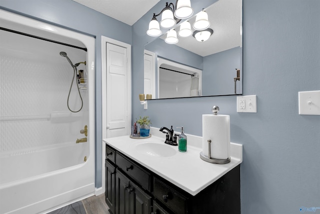 bathroom with vanity and bathtub / shower combination