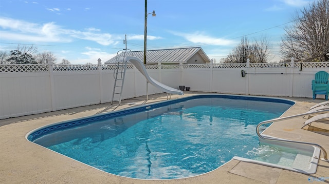 view of pool with a water slide