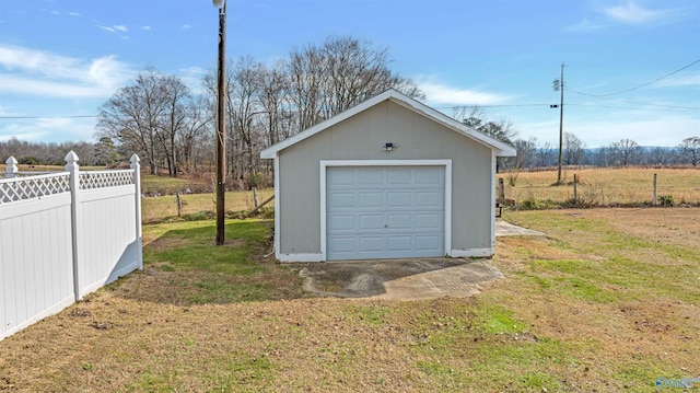 garage featuring a yard