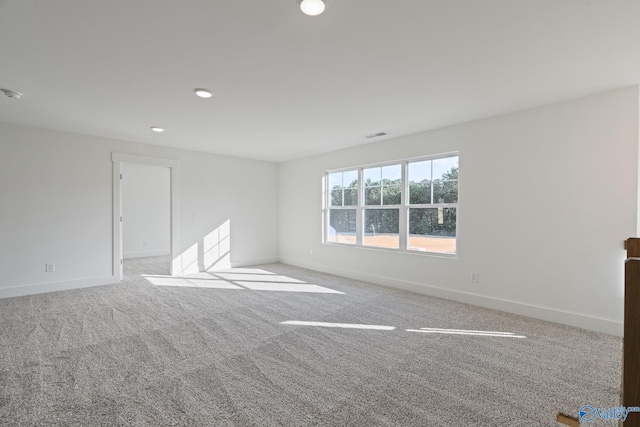 empty room featuring light colored carpet