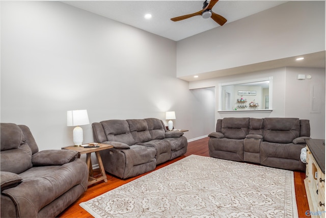 living room featuring ceiling fan and wood-type flooring