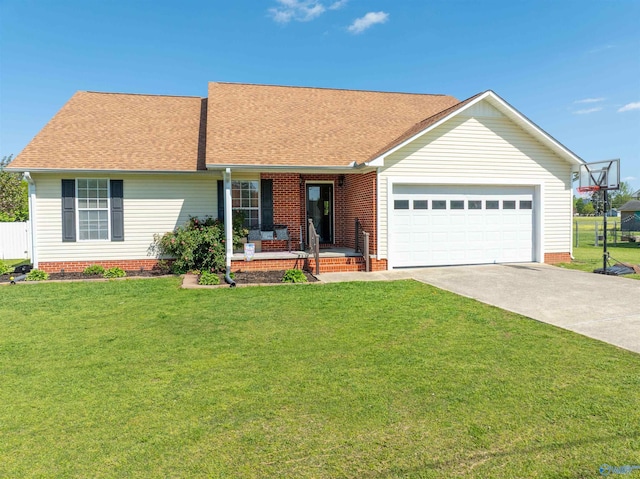 1045 Cove Rd, Southside, AL 35907 - ranch-style home featuring a shingled roof, covered porch, a garage, concrete driveway, and a front lawn