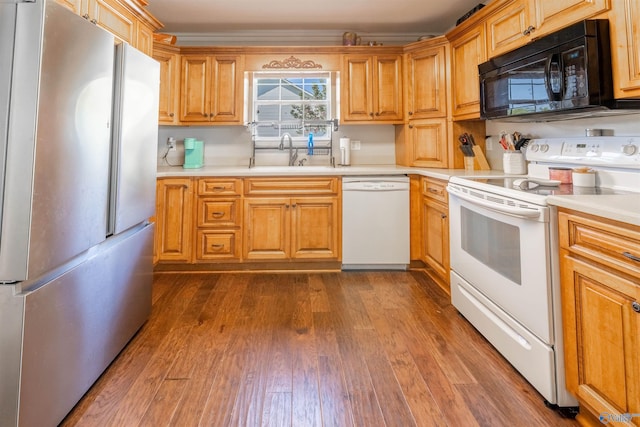 1045 Cove Rd, Southside, AL 35907 - kitchen featuring white appliances, dark wood-style flooring, light countertops, and a sink