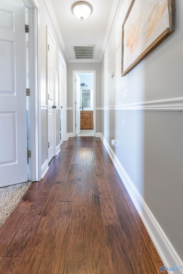 1045 Cove Rd, Southside, AL 35907 - hallway with visible vents, baseboards, ornamental molding, and dark wood finished floors