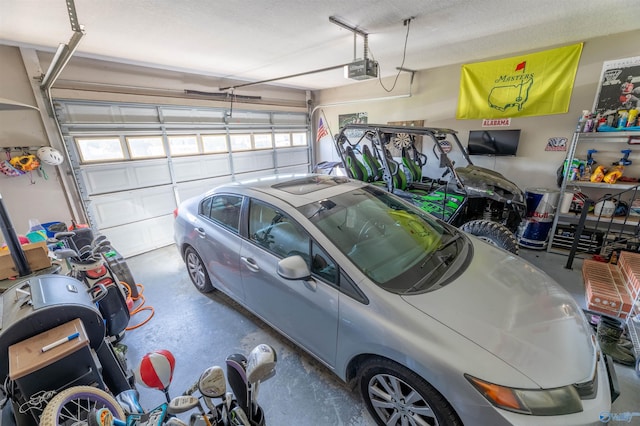 1045 Cove Rd, Southside, AL 35907 - garage featuring a garage door opener