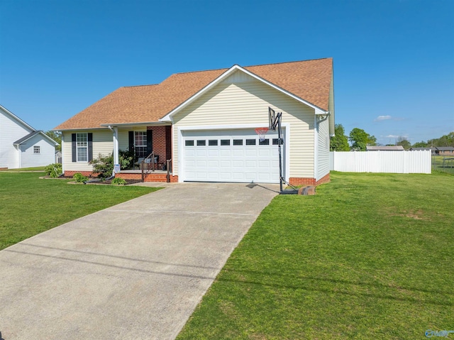 1045 Cove Rd, Southside, AL 35907 - ranch-style house featuring an attached garage, concrete driveway, a front yard, and fence