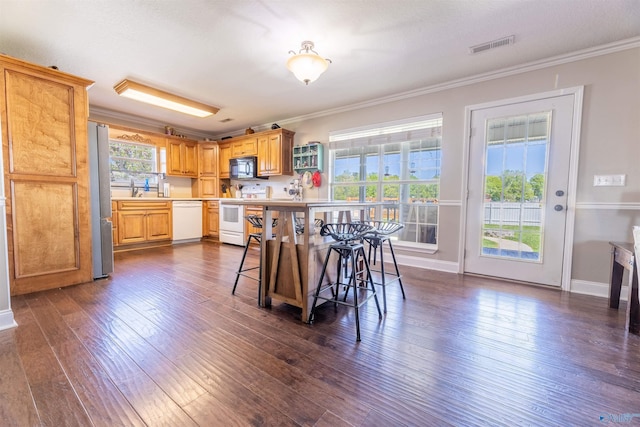 1045 Cove Rd, Southside, AL 35907 - kitchen featuring crown molding, dark wood finished floors, light countertops, and white appliances