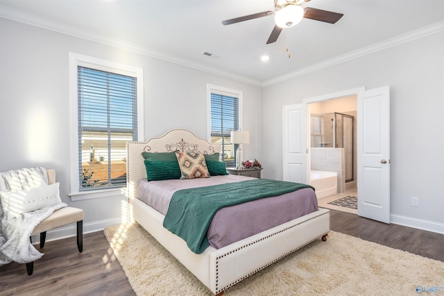 bedroom featuring dark wood-type flooring, ensuite bath, ornamental molding, and multiple windows