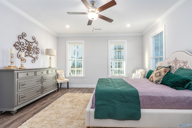 bedroom with crown molding, ceiling fan, and dark wood-type flooring