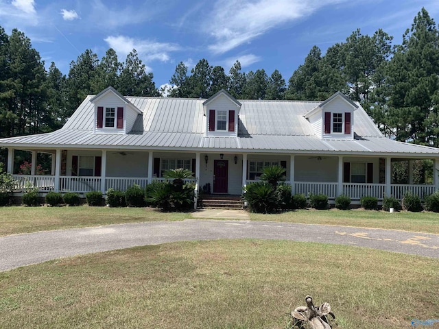 farmhouse-style home with a front lawn