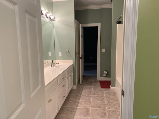 bathroom with tile patterned floors, vanity, and ornamental molding