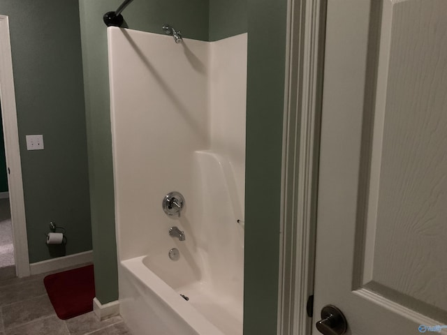 bathroom with shower / washtub combination and tile patterned flooring