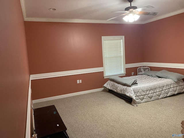 bedroom with ceiling fan, carpet floors, and ornamental molding