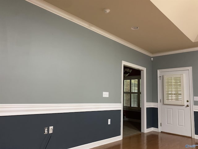 unfurnished room featuring dark hardwood / wood-style flooring and crown molding