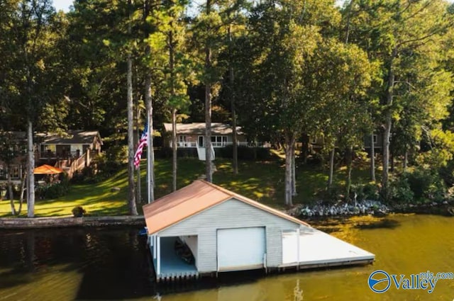 dock area with a water view and a yard