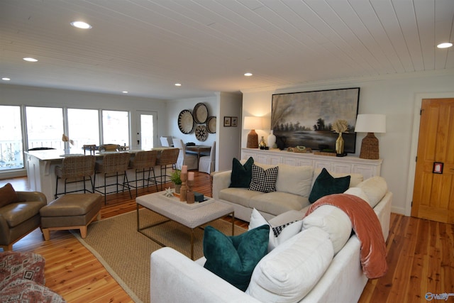 living room with wooden ceiling and light wood-type flooring