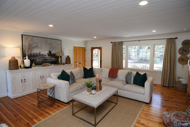 living room with crown molding, wood ceiling, and light hardwood / wood-style flooring