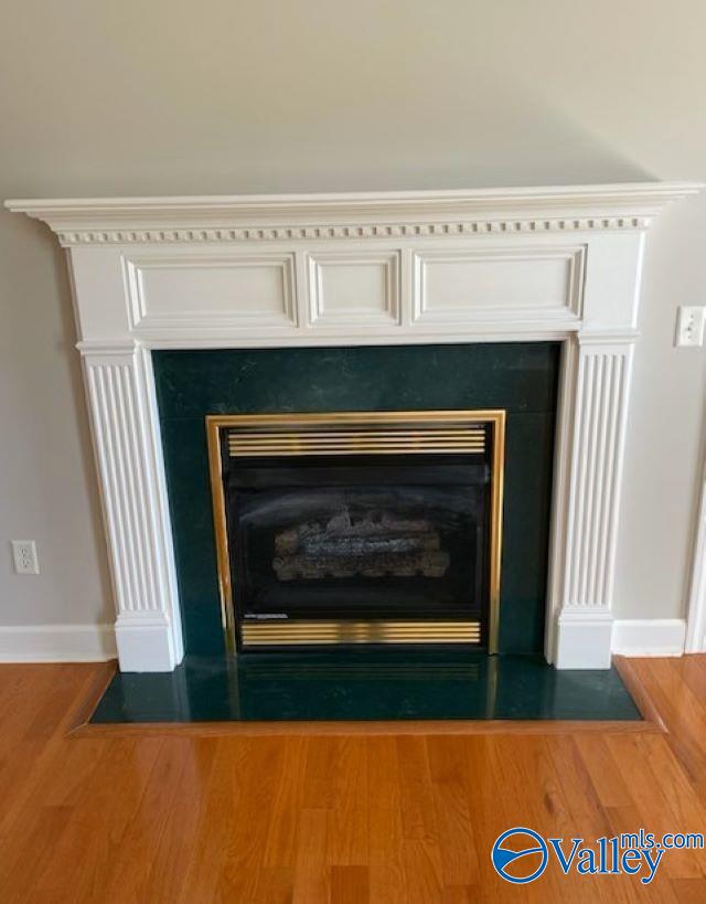 details with hardwood / wood-style flooring