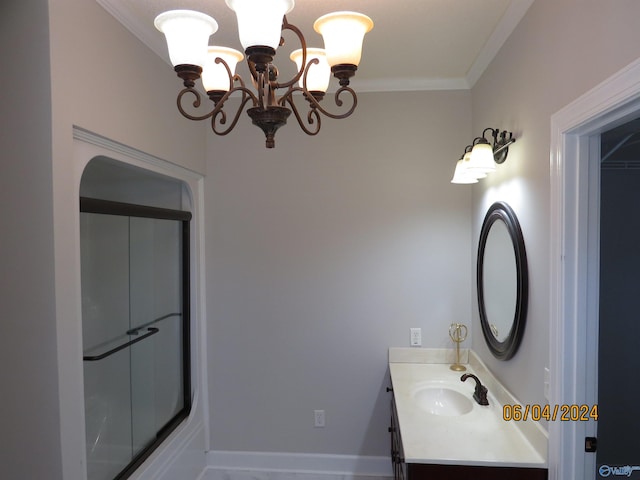 bathroom featuring vanity, crown molding, and an inviting chandelier