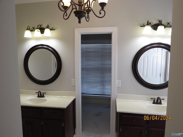 bathroom featuring vanity and a notable chandelier