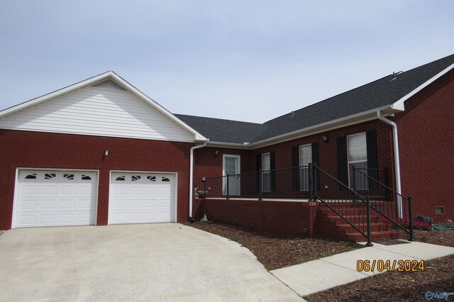 single story home featuring a garage