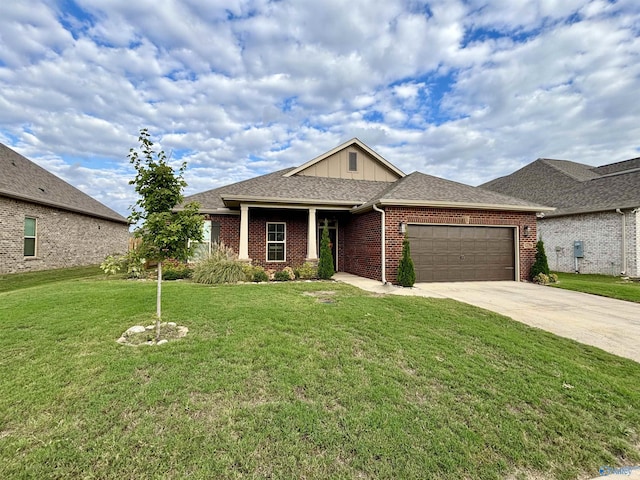 12794 Hudbug Dr, Madison, AL 35756 - view of front of home featuring a garage, driveway, a front yard, brick siding, and board and batten siding
