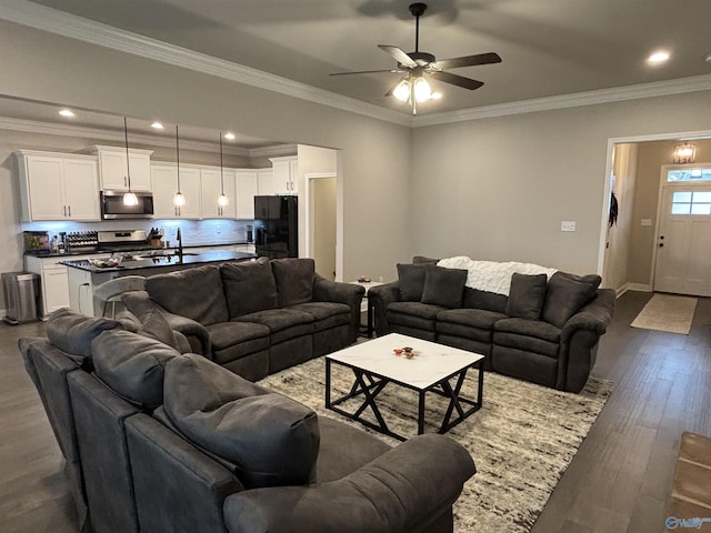 12794 Hudbug Dr, Madison, AL 35756 - living room featuring a ceiling fan, dark wood-style flooring, crown molding, recessed lighting, and baseboards