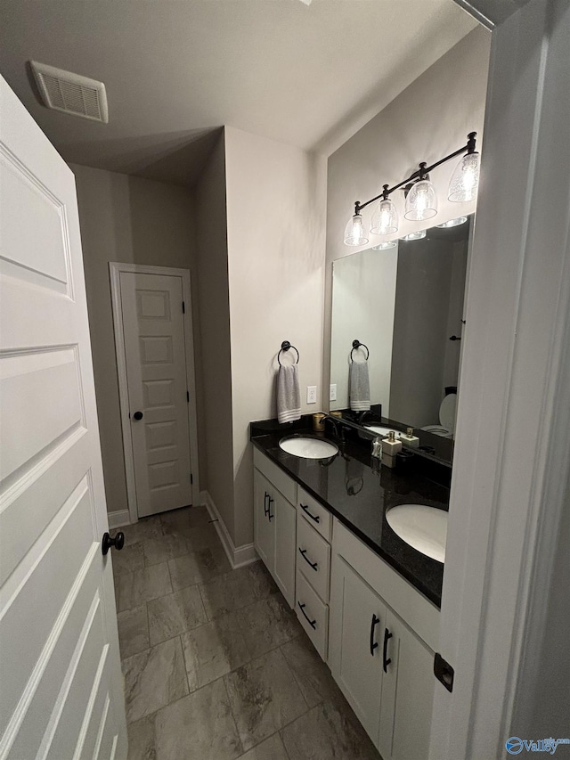 12794 Hudbug Dr, Madison, AL 35756 - full bathroom with double vanity, baseboards, and marble finish floors