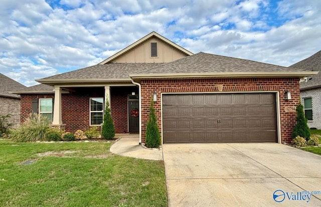 12794 Hudbug Dr, Madison, AL 35756 - ranch-style house with brick siding, an attached garage, concrete driveway, and a front yard