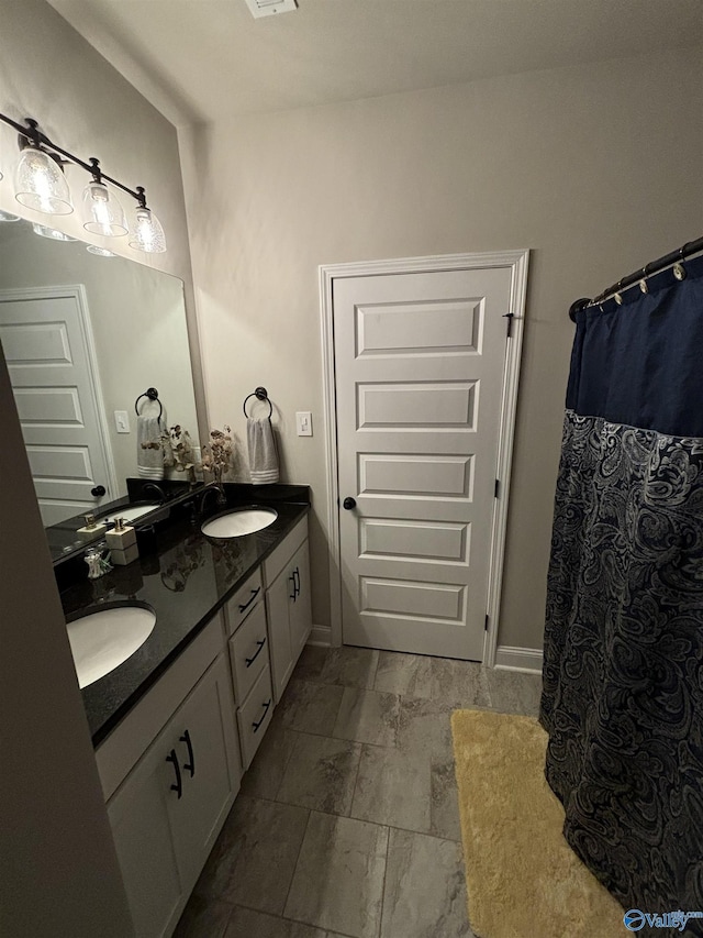 12794 Hudbug Dr, Madison, AL 35756 - full bathroom featuring double vanity and baseboards