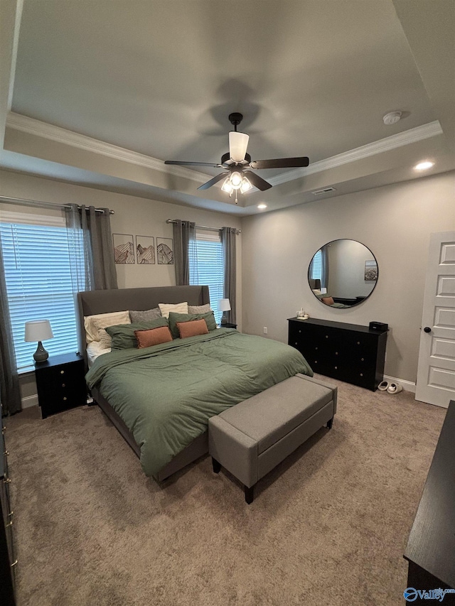 12794 Hudbug Dr, Madison, AL 35756 - carpeted bedroom with a tray ceiling, crown molding, ceiling fan, and baseboards