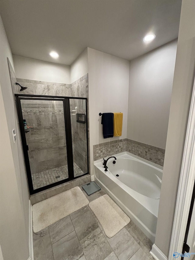 12794 Hudbug Dr, Madison, AL 35756 - full bathroom with a bath, a shower stall, and recessed lighting