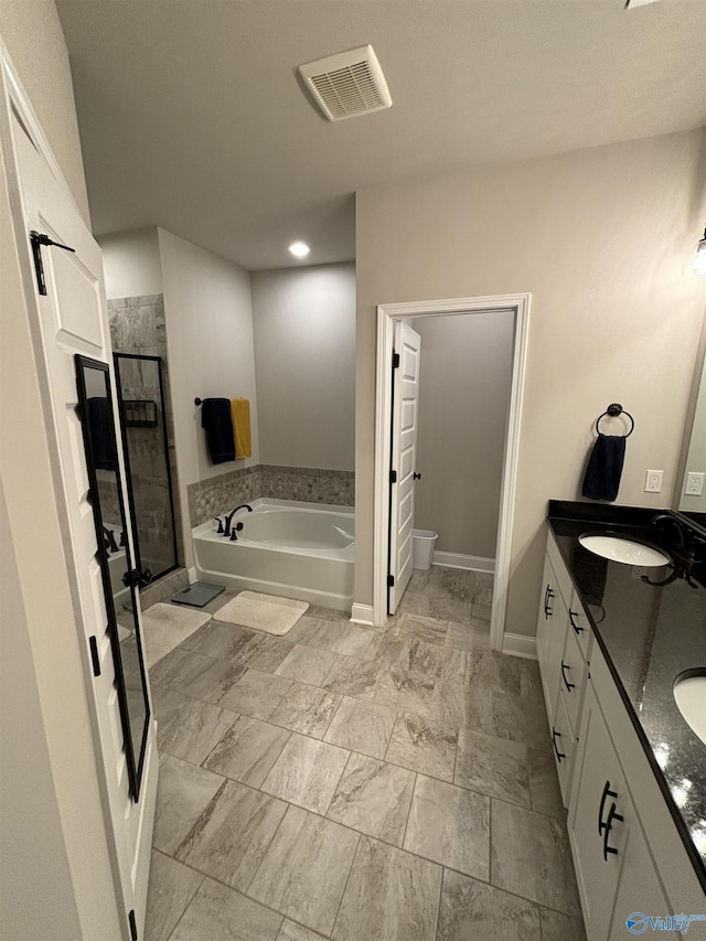 12794 Hudbug Dr, Madison, AL 35756 - full bath with a shower stall, a bath, double vanity, baseboards, and toilet