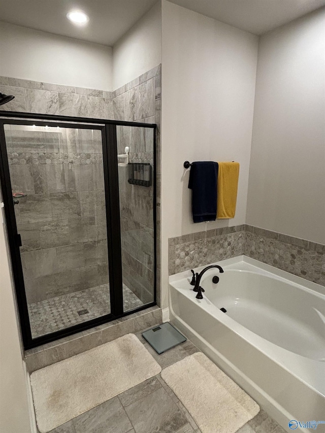12794 Hudbug Dr, Madison, AL 35756 - bathroom with a bath, a stall shower, and recessed lighting