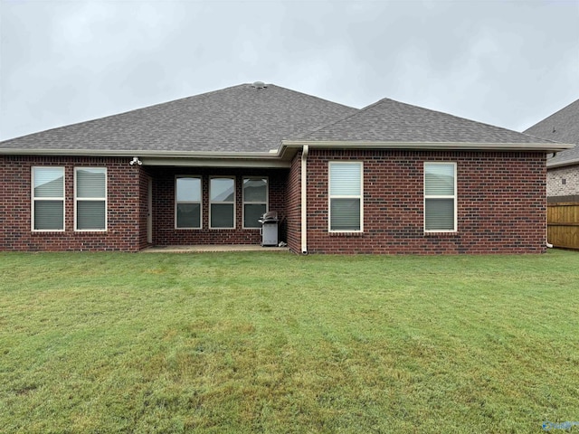12794 Hudbug Dr, Madison, AL 35756 - rear view of property featuring a shingled roof and brick siding