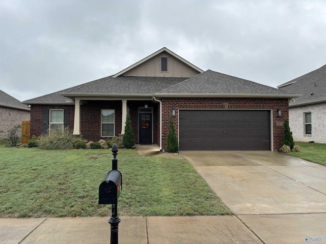 12794 Hudbug Dr, Madison, AL 35756 - view of front facade with brick siding, an attached garage, and a front lawn