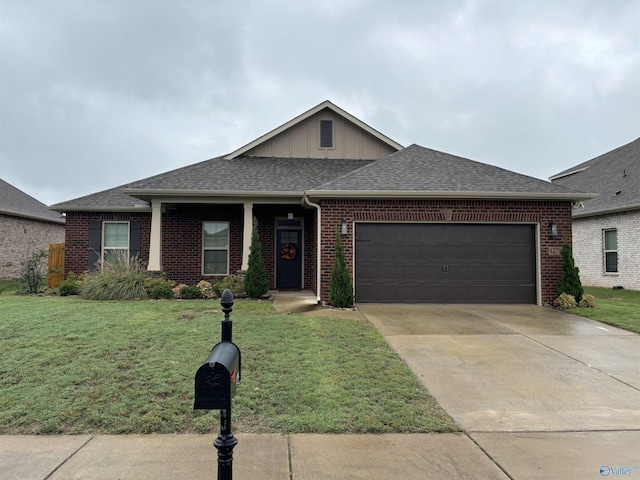 12794 Hudbug Dr, Madison, AL 35756 - view of front of house featuring brick siding, board and batten siding, a front yard, and an attached garage