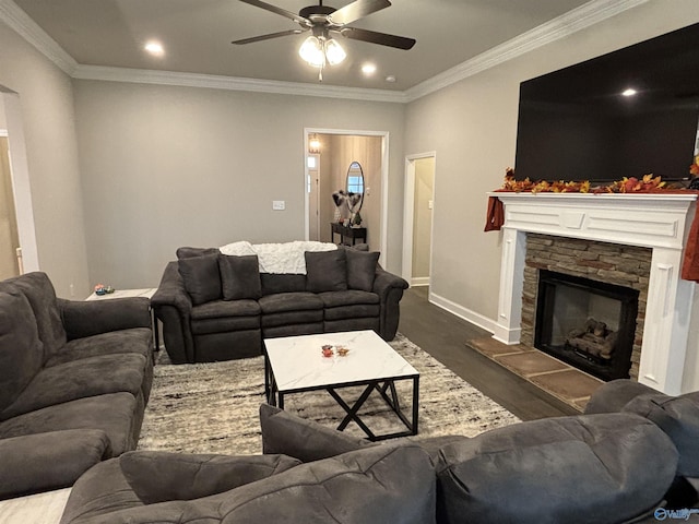 12794 Hudbug Dr, Madison, AL 35756 - living area featuring ceiling fan, dark wood-type flooring, baseboards, a fireplace, and crown molding
