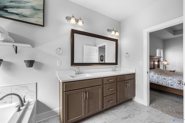 full bath with marble finish floor, double vanity, a sink, and connected bathroom