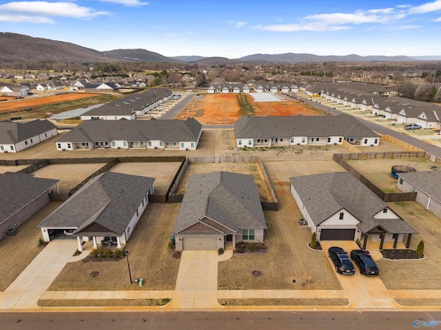 drone / aerial view with a mountain view and a residential view