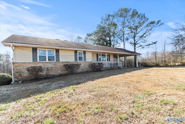 ranch-style house with a front yard and a porch